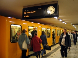 Photo: A U-Bahn train in a station in Berlin, with passengers embarking and disembarking