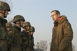 The Parliamentary Commissioner for the Armed Forces conversing with soldiers during a visit to a military unit