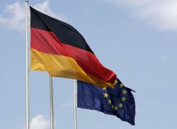 The German flag fluttering in the wind next to the European flag