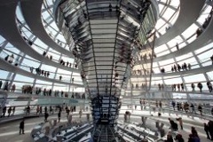 Photo: visitors walking around the dome of the Reichtags Building and reading information boards