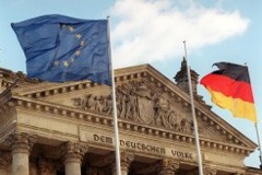 The European flag and the German national flag in front of the Reichstag Building