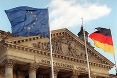 The European flag and the German national flag in front of the Reichstag Building