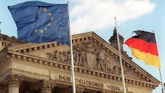 The European flag and the German national flag in front of the Reichstag Building