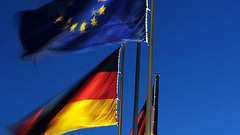 European and German flags in front of the Reichstag building